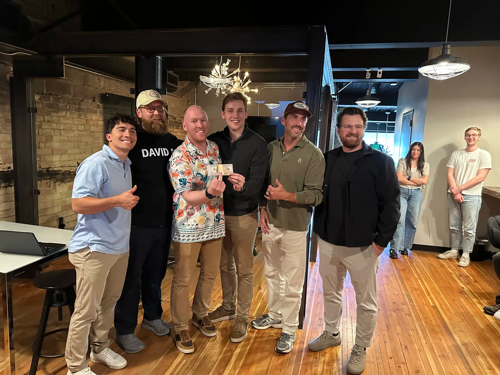 The Swarmy team holding the winning check at the DAVID AI Hackathon